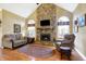 Relaxing Gathering room with a stone fireplace and hardwood floors at 1398 Penny Ln, Greenfield, IN 46140