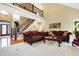 Spacious living room with hardwood floors, high ceilings, and a staircase at 1398 Penny Ln, Greenfield, IN 46140