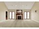 Bright living room with fireplace and doors leading to the outside and hardwood floors at 1398 Penny Ln, Greenfield, IN 46140
