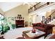 Large living room with vaulted ceilings, a piano, and two sofas at 1398 Penny Ln, Greenfield, IN 46140