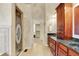 Bathroom with tiled floors, double vanity with marble countertops, and glass enclosed shower at 1398 Penny Ln, Greenfield, IN 46140