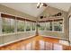 Bright sun room with hardwood floors and many windows offering great views at 1398 Penny Ln, Greenfield, IN 46140