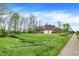 Large lot with mature trees surrounding this brick home provides a beautiful view and serene atmosphere at 1398 Penny Ln, Greenfield, IN 46140