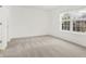 Bright bedroom with neutral carpet and large window, offering ample natural light at 14944 Mia Dr, Carmel, IN 46033