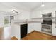 Modern kitchen features stainless steel appliances, white cabinets, and a view to the outside at 14944 Mia Dr, Carmel, IN 46033