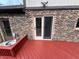 Close up of the wooden deck and sliding door for easy access from the backyard at 409 Lansdowne Rd, Indianapolis, IN 46234
