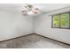 Neutral bedroom with carpet, a ceiling fan, and a window providing natural light at 409 Lansdowne Rd, Indianapolis, IN 46234