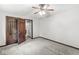 Cozy bedroom with carpet and two paneled doors, offering comfortable living space at 409 Lansdowne Rd, Indianapolis, IN 46234