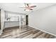 Open-concept dining area with stylish wood-look flooring, seamlessly connected to the modern kitchen, creating a bright and inviting space at 409 Lansdowne Rd, Indianapolis, IN 46234