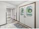 Inviting foyer with decorative glass doors and patterned rug at 409 Lansdowne Rd, Indianapolis, IN 46234