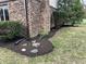 Front yard with mature landscaping, beautiful bushes and budding flowers at 409 Lansdowne Rd, Indianapolis, IN 46234