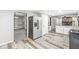 Spacious kitchen with modern appliances and stylish wood flooring at 409 Lansdowne Rd, Indianapolis, IN 46234