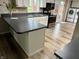 Bright kitchen features updated cabinets, countertops and stainless steel appliances at 409 Lansdowne Rd, Indianapolis, IN 46234