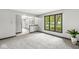 Bright living room with large window offering verdant outdoor views at 409 Lansdowne Rd, Indianapolis, IN 46234