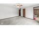 Expansive main bedroom featuring plush carpeting, neutral walls, and convenient access to an en-suite bathroom at 409 Lansdowne Rd, Indianapolis, IN 46234