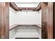 Spacious walk-in closet featuring shelving and ample storage space at 409 Lansdowne Rd, Indianapolis, IN 46234