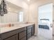 Bathroom with double vanity and a view into a bedroom at 4612 Amber Wood Dr, Indianapolis, IN 46235