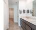 Modern bathroom with double vanity, granite countertop, and shower at 4612 Amber Wood Dr, Indianapolis, IN 46235