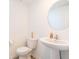 Clean and simple half bathroom with white fixtures at 4612 Amber Wood Dr, Indianapolis, IN 46235