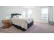 Bright bedroom with carpeted floor, neutral walls, and large windows at 4612 Amber Wood Dr, Indianapolis, IN 46235