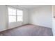 Spacious bedroom with large window and neutral wall color at 4612 Amber Wood Dr, Indianapolis, IN 46235
