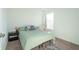Bright bedroom with a double bed, nightstand, and window at 4612 Amber Wood Dr, Indianapolis, IN 46235