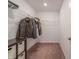 Large walk-in closet with built-in shelving and hanging rods at 4612 Amber Wood Dr, Indianapolis, IN 46235