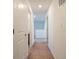 Long hallway with carpet and doors to bedrooms and bath at 4612 Amber Wood Dr, Indianapolis, IN 46235