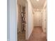 Hallway with access to bedrooms and a utility closet at 4612 Amber Wood Dr, Indianapolis, IN 46235