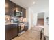 Modern kitchen with stainless steel appliances and tile backsplash at 4612 Amber Wood Dr, Indianapolis, IN 46235