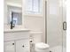 Well-lit bathroom featuring a vanity with modern faucet and a shower with glass doors at 467 Rayle Dr, Carmel, IN 46032