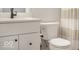 Clean bathroom featuring a toilet, vanity with modern faucet, and shower with tiled walls at 467 Rayle Dr, Carmel, IN 46032