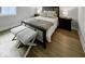 Bedroom with a bed, side tables, lamps, stools and a window at 467 Rayle Dr, Carmel, IN 46032