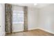 Bedroom highlighting a window with patterned curtains, offering a bright, open feel at 467 Rayle Dr, Carmel, IN 46032
