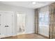 Bedroom showcasing decorative curtains and a view into the ensuite bathroom with a white toilet at 467 Rayle Dr, Carmel, IN 46032