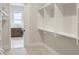 Walk-in closet with shelving and a view to the laundry room at 467 Rayle Dr, Carmel, IN 46032