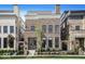 Stately brick home featuring a symmetrical facade, large windows, and manicured landscaping at 467 Rayle Dr, Carmel, IN 46032