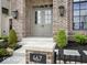 Inviting brick home featuring a stylish front door and well-manicured landscaping at 467 Rayle Dr, Carmel, IN 46032