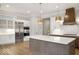 Spacious kitchen with a central island, modern stainless steel appliances, and custom cabinetry at 467 Rayle Dr, Carmel, IN 46032