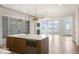 Open kitchen concept with a large center island, modern appliances, and patio access at 467 Rayle Dr, Carmel, IN 46032