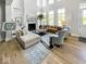 Spacious living room with modern decor, fireplace, and a large area rug at 467 Rayle Dr, Carmel, IN 46032