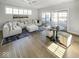 Comfortable living room with plush seating, ceiling fan, and access to outside deck at 467 Rayle Dr, Carmel, IN 46032
