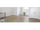 Spacious living room featuring wood floors, staircase, and wet bar for entertaining at 467 Rayle Dr, Carmel, IN 46032