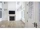 Open living room with fireplace, hardwood floors, and abundant natural light at 467 Rayle Dr, Carmel, IN 46032