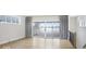 Open living space with hardwood floors, sliding glass doors, and views to outside deck at 467 Rayle Dr, Carmel, IN 46032