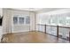 Upstairs loft with wood floors, lots of windows, and modern, white curtains at 467 Rayle Dr, Carmel, IN 46032