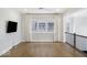 Upstairs loft featuring wood floors, lots of windows, and a wall-mounted television at 467 Rayle Dr, Carmel, IN 46032