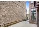 View of a brick patio in between two homes with plants, rocks, and string lights at 467 Rayle Dr, Carmel, IN 46032
