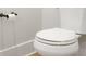 Toilet with a white seat and a toilet paper holder on the wall at 467 Rayle Dr, Carmel, IN 46032