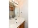 Clean bathroom with single sink vanity and a toilet at 5921 Bastille Ln, Indianapolis, IN 46254